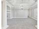 Formal dining room featuring a chandelier and built-in shelving at 5034 Hickory Hills Dr, Woodstock, GA 30188