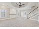 Bright living room featuring a fireplace and large windows at 5034 Hickory Hills Dr, Woodstock, GA 30188