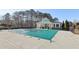 Community pool with green cover and clubhouse at 5034 Hickory Hills Dr, Woodstock, GA 30188