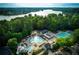 Community pool and lake view with lush green surroundings at 6320 Bannerhorn Run, Alpharetta, GA 30005