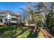 Large backyard with playground and house view at 6320 Bannerhorn Run, Alpharetta, GA 30005