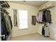 Large walk-in closet with ample shelving and hanging space at 6320 Bannerhorn Run, Alpharetta, GA 30005