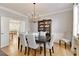 Formal dining room with chandelier and hardwood floors at 6320 Bannerhorn Run, Alpharetta, GA 30005