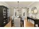 Formal dining room with hardwood floors and large windows at 6320 Bannerhorn Run, Alpharetta, GA 30005