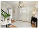 Bright entryway with hardwood floors and white door at 6320 Bannerhorn Run, Alpharetta, GA 30005