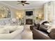 Spacious living room features a fireplace, comfy seating, and large windows at 6320 Bannerhorn Run, Alpharetta, GA 30005