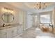 Spa-like bathroom with soaking tub, walk-in shower, and double vanity at 6320 Bannerhorn Run, Alpharetta, GA 30005