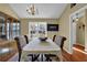 Bright dining room featuring a chandelier and hardwood floors at 1460 Chamblee Gap Rd, Cumming, GA 30040