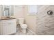 Updated bathroom with white vanity and tile flooring at 2159 Macon Sw Dr, Atlanta, GA 30315