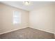 Simple bedroom with neutral carpet and one window at 2159 Macon Sw Dr, Atlanta, GA 30315