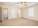 Primary bedroom with ceiling fan and carpet at 2159 Macon Sw Dr, Atlanta, GA 30315