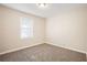 Bright bedroom with neutral walls and carpeted floors at 2159 Macon Sw Dr, Atlanta, GA 30315