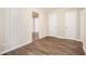 Bright hallway with wood-look floors and access to bedrooms at 2159 Macon Sw Dr, Atlanta, GA 30315