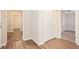 Hallway with double door closet and wood-look floors at 2159 Macon Sw Dr, Atlanta, GA 30315