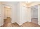 Spacious hallway with wood-look floors and ample storage at 2159 Macon Sw Dr, Atlanta, GA 30315