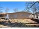 Brick ranch house with a spacious yard and attached carport at 2159 Macon Sw Dr, Atlanta, GA 30315