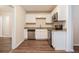 Modern kitchen with white cabinets and granite countertops at 2159 Macon Sw Dr, Atlanta, GA 30315