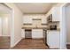 Modern kitchen with white cabinets and granite countertops at 2159 Macon Sw Dr, Atlanta, GA 30315
