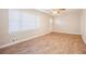 Living room featuring wood-look floors and large windows at 2159 Macon Sw Dr, Atlanta, GA 30315