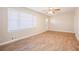 Living room featuring wood-look floors and large windows at 2159 Macon Sw Dr, Atlanta, GA 30315