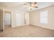 Spacious main bedroom with carpet, ceiling fan and ensuite bathroom at 2159 Macon Sw Dr, Atlanta, GA 30315