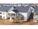 Backyard view featuring a screened-in porch and a wooden deck with stairs leading to the yard at 5860 Collier Bridge Ln, Hoschton, GA 30548