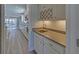 Convenient bar area featuring a sink, wine rack and built-in cabinetry at 5860 Collier Bridge Ln, Hoschton, GA 30548