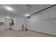 Spacious two-car garage with high ceilings and automatic door opener offers ample storage and convenience at 5860 Collier Bridge Ln, Hoschton, GA 30548