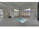 A hot tub area with large windows and ample seating, located next to the indoor pool at 5860 Collier Bridge Ln, Hoschton, GA 30548