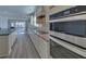 Contemporary kitchen with stainless oven and appliances and sleek countertop at 5860 Collier Bridge Ln, Hoschton, GA 30548