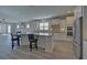 Open kitchen featuring a large island, stainless steel appliances, and ample cabinet space at 5860 Collier Bridge Ln, Hoschton, GA 30548