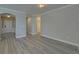 Living room features an open layout with modern floors and neutral decor at 5860 Collier Bridge Ln, Hoschton, GA 30548