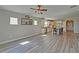 Expansive living room showcasing kitchen, ample natural light, and modern decor at 5860 Collier Bridge Ln, Hoschton, GA 30548