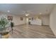 Spacious living room featuring light wood floors, recessed lighting, ceiling fan, and neutral wall paint at 5860 Collier Bridge Ln, Hoschton, GA 30548