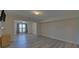 Spacious living room with light wood floors and large opening for a flexible open concept at 5860 Collier Bridge Ln, Hoschton, GA 30548