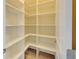 Walk-in pantry with multiple shelves for ample storage and organization at 5860 Collier Bridge Ln, Hoschton, GA 30548
