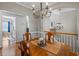 Bright dining room with hardwood floors and chandelier at 1010 Woodward Park Dr, Suwanee, GA 30024