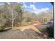 Wooded backyard with storage sheds at 1955 E Lake Dr, Marietta, GA 30066