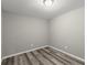 Finished basement room with gray walls and flooring at 1955 E Lake Dr, Marietta, GA 30066