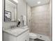Modern bathroom with a shower and granite vanity at 1955 E Lake Dr, Marietta, GA 30066
