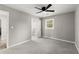 Spacious bedroom with neutral gray walls and plush gray carpeting at 1955 E Lake Dr, Marietta, GA 30066
