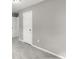 Simple bedroom with gray walls, gray carpet, and a white door at 1955 E Lake Dr, Marietta, GA 30066