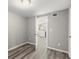Bright bedroom with wood-look floors and view into kitchen at 1955 E Lake Dr, Marietta, GA 30066