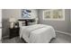 Primary bedroom with gray walls, plush carpeting, and a comfortable bed at 1955 E Lake Dr, Marietta, GA 30066