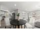 Bright dining area with a table and chairs, offering an open view to the kitchen at 1955 E Lake Dr, Marietta, GA 30066