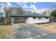 Newly renovated ranch home with carport and landscaped yard at 1955 E Lake Dr, Marietta, GA 30066