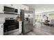 Stainless steel appliances and white cabinets in a contemporary kitchen at 1955 E Lake Dr, Marietta, GA 30066