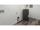 Laundry area with vinyl flooring and new water heater at 1955 E Lake Dr, Marietta, GA 30066