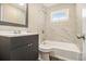 Clean bathroom, featuring a shower/tub combo and marble-look tile at 3766 Stanford Cir, Decatur, GA 30034