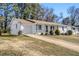 White brick ranch home with a long driveway at 3766 Stanford Cir, Decatur, GA 30034
